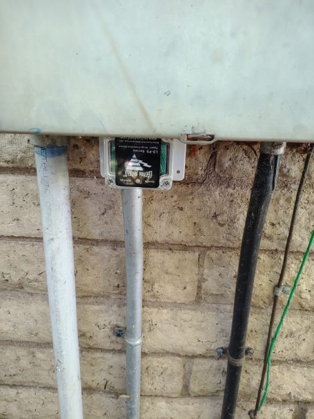 Junction box and conduit on block wall