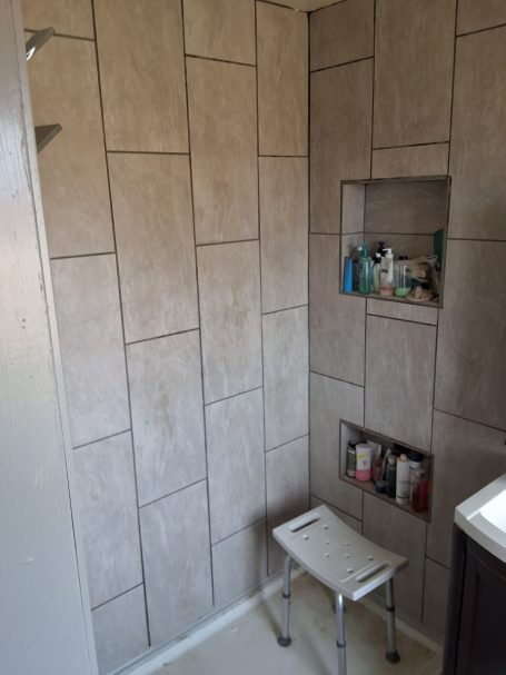Shower tile with built-in niche