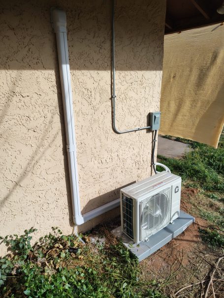 Mini-split unit on exterior wall
